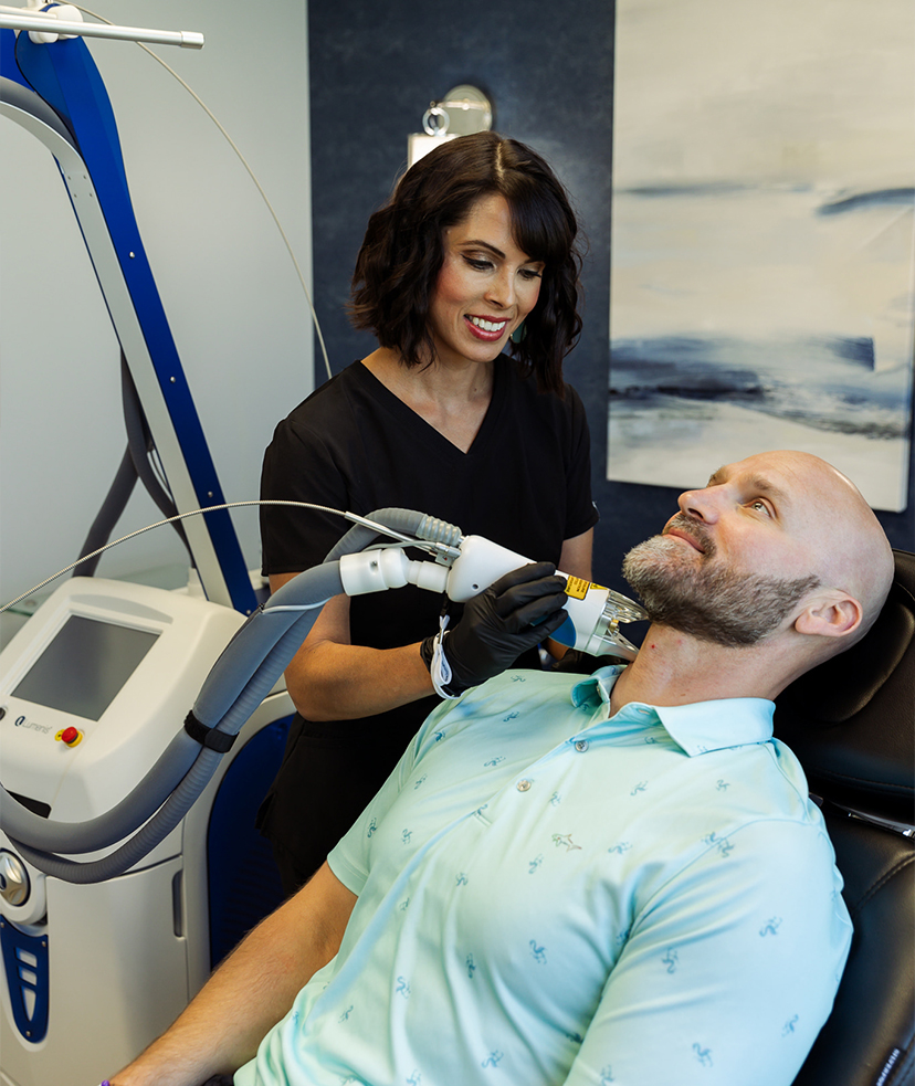 Photo of a man getting laser hair reduction treatments at Synergi MedSpa