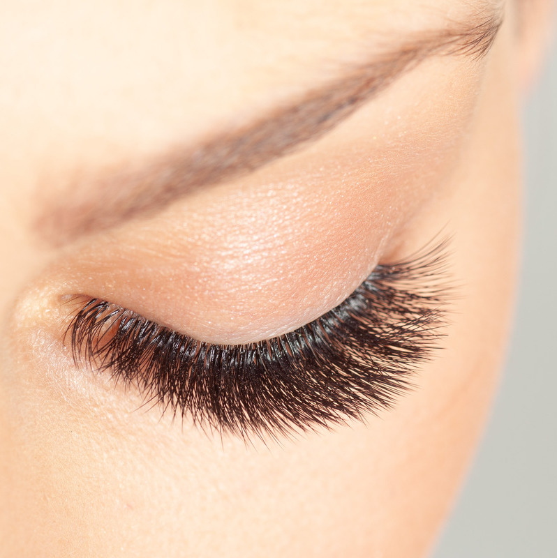Photo of a woman's lashes after lash extensions were added
